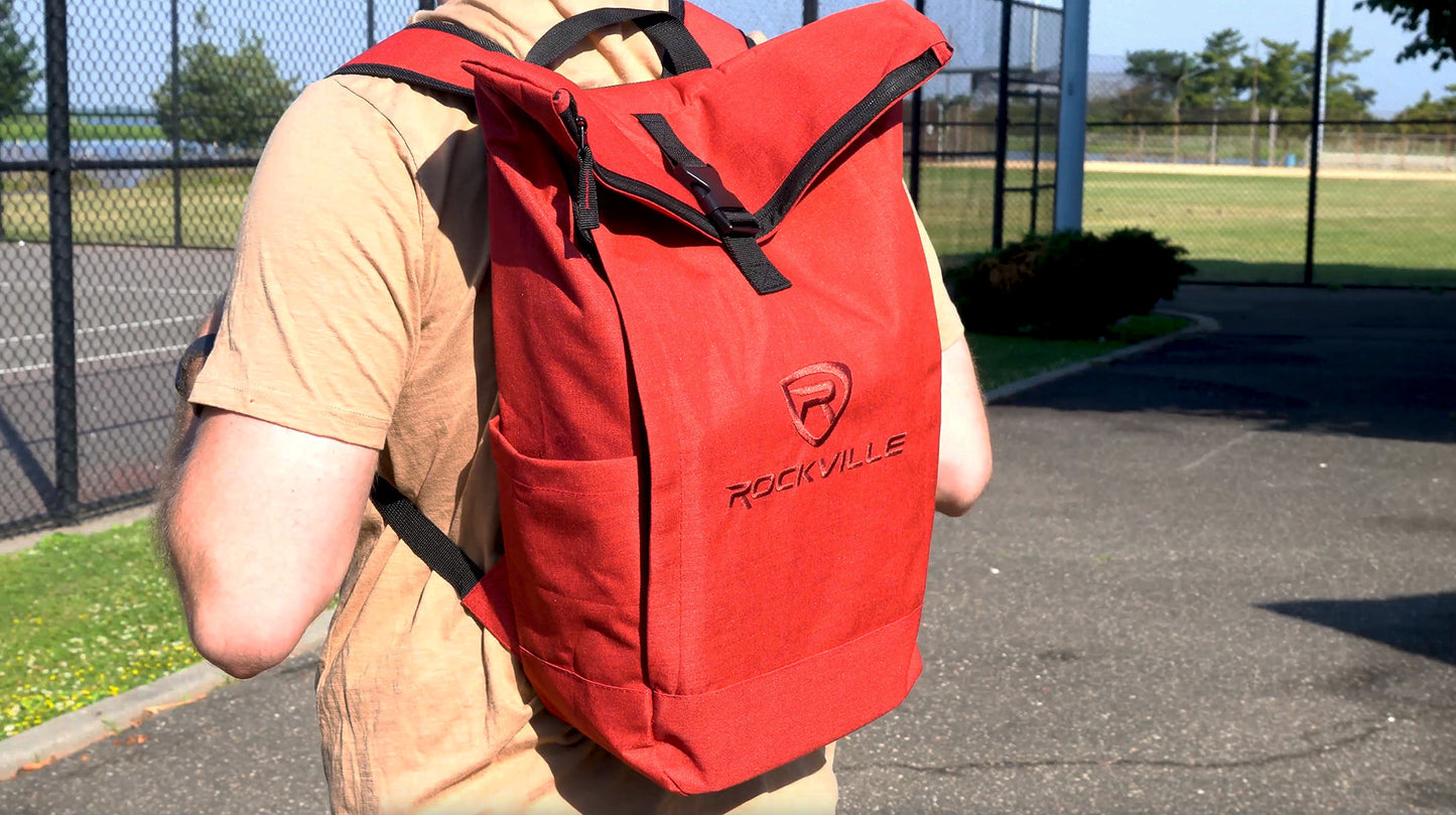 Person wearing a red backpack with 'Rockville' logo outdoors.