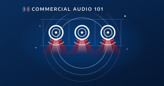 Commercial Audio 101: line drawing of three 70V ceiling speakers in a row of drop-ceiling tiles, each sending a soft red sound cone that overlaps the next for even coverage, on a deep navy background with a bright blue glow and rings.
