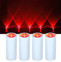 Four cylindrical red light projectors with a dark background