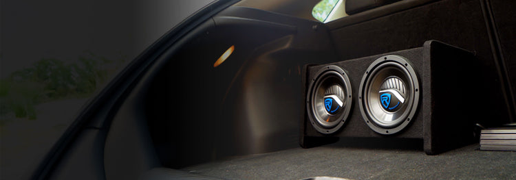 Car subwoofer installed in a vehicle's floor.
