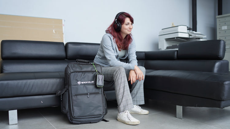 Student sitting with RPB27 v2 and backpack