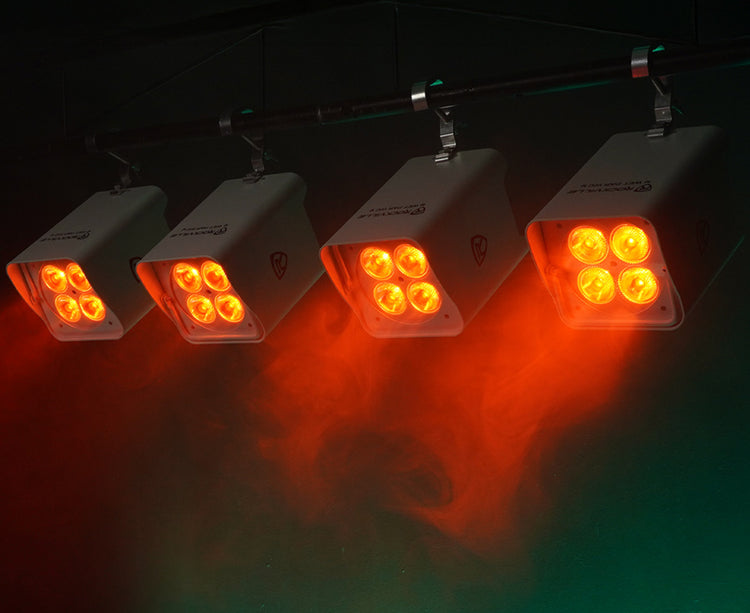 Four orange LED lights on a dark background