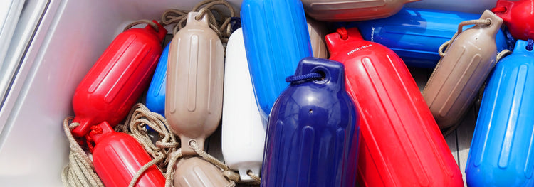 Colorful inflatable life vests in a storage compartment.